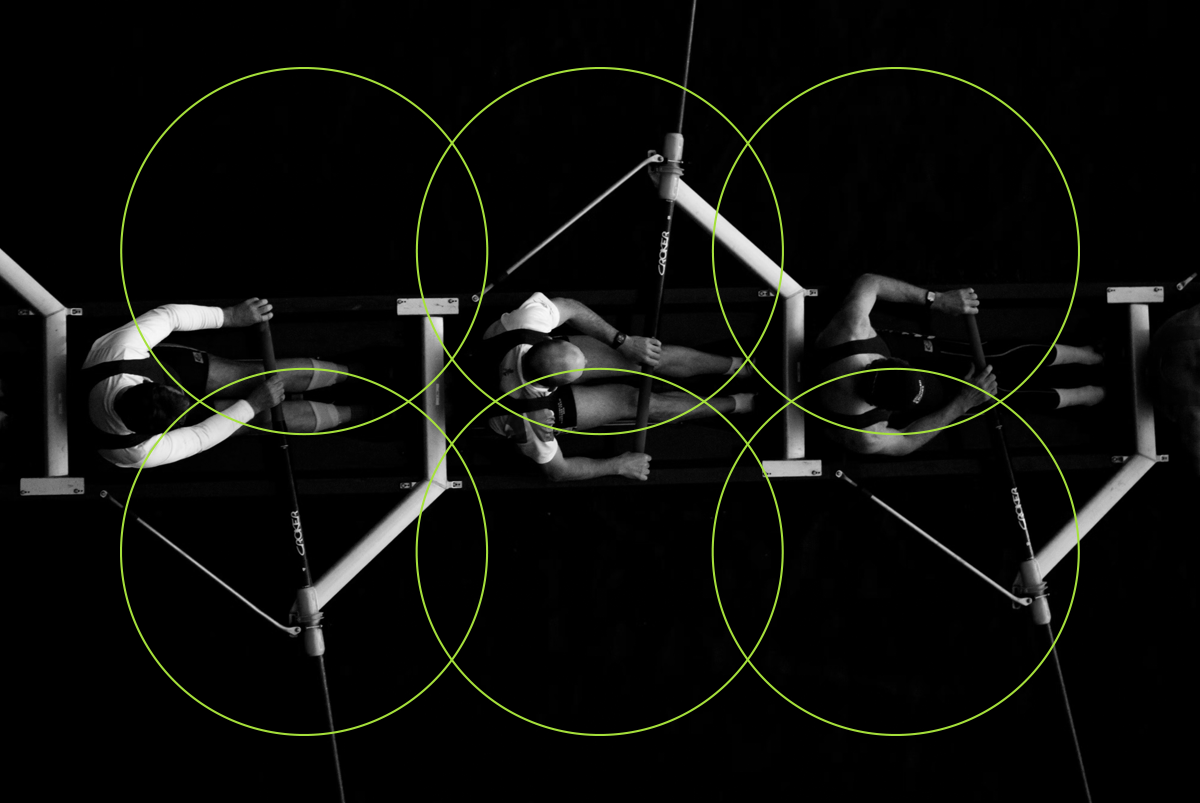 Image of a crew boat with a graphical overlay of interlocking circles.